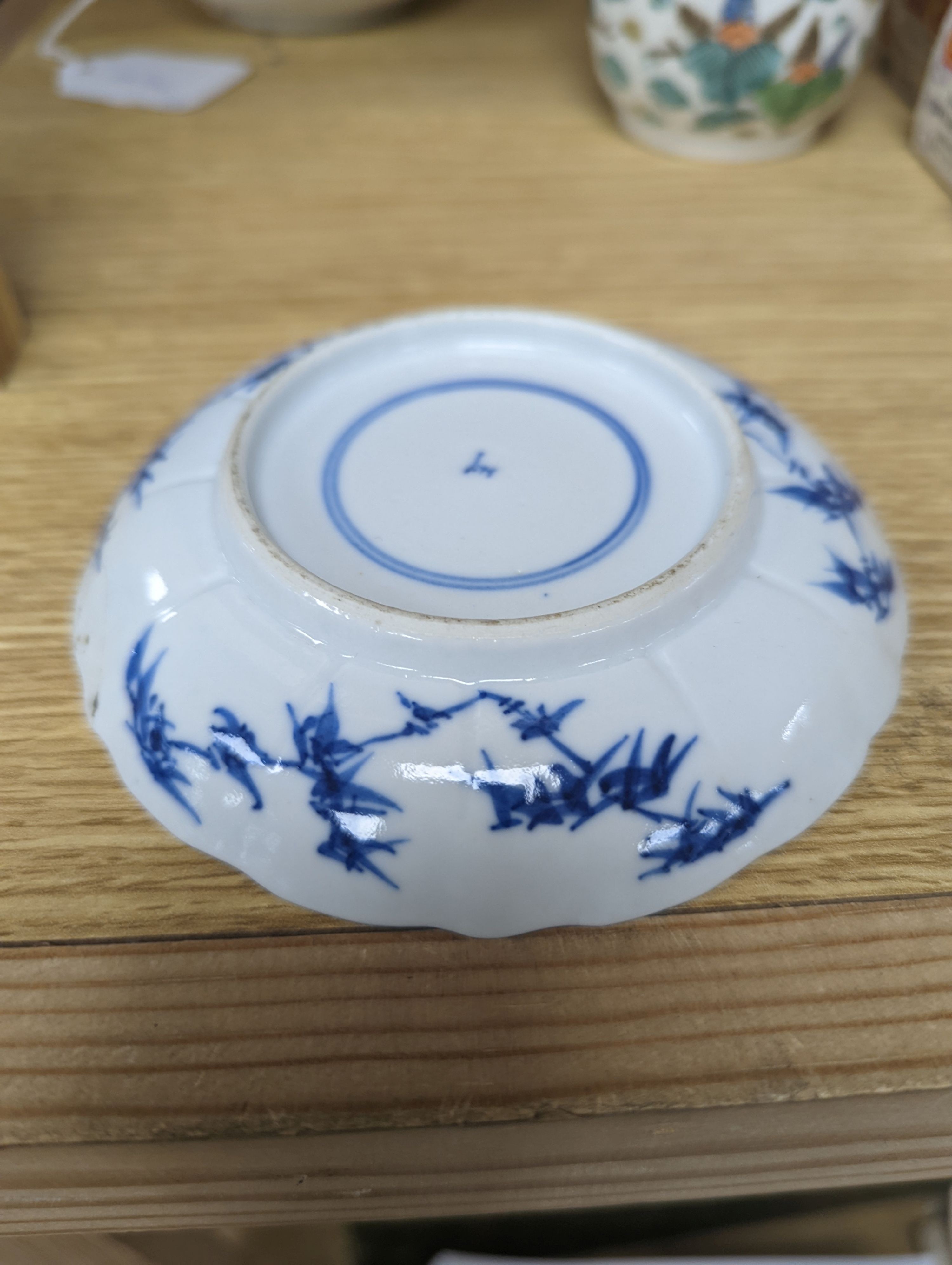 Two Chinese porcelain saucer dishes and an enamelled porcelain vase, 18th century and later, 12.5cm